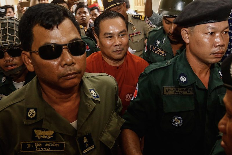 Opposition lawmaker Um Sam An, center, enters the Appeal Court in Phnom Penh in May. (Siv Channa/The Cambodia Daily) 