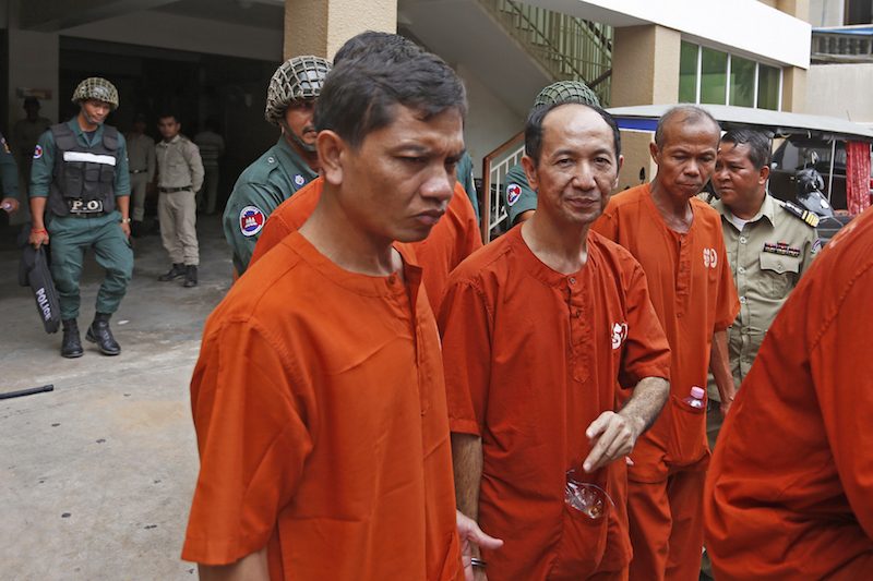 Defendants on trial over a 2014 incitement case leave Phnom Penh Municipal Court on Monday. (Siv Channa/The Cambodia Daily)