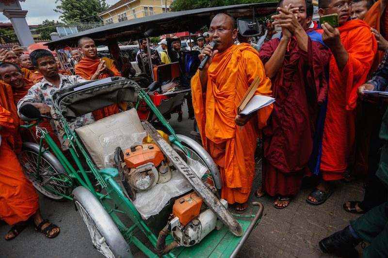 But Buntenh speaks outside the Forestry Administration’s headquarters in Phnom Penh last year as monks display chainsaws seized from illegal loggers in the Prey Lang forest. (Siv Channa/The Cambodia Daily)