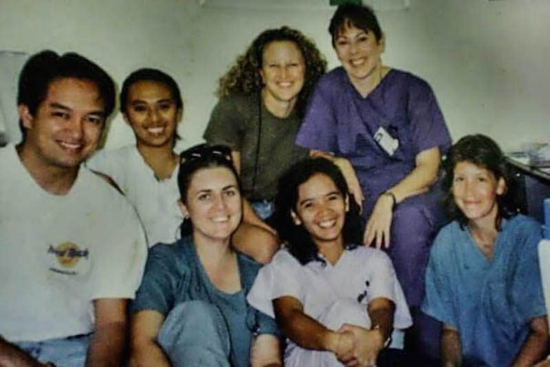 Original staff members of the Sihanouk Hospital Center of Hope in Phnom Penh pose for a photograph in 1998. Cathy Pingoy, who supplied the photo, is third from right.