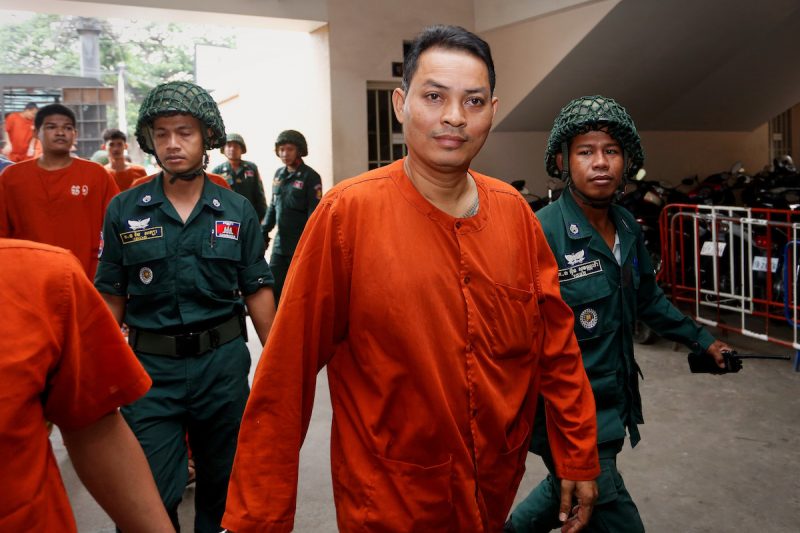 Cambodia's former ambassador to South Korea, Suth Dina, arrives at the Phnom Penh Municipal Court for his corruption trial on Friday. (Siv Channa/The Cambodia Daily)