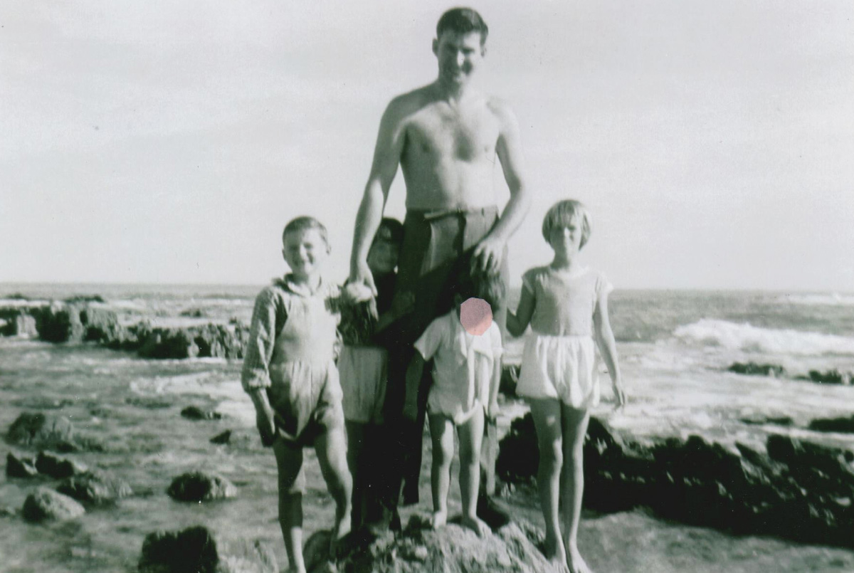 Max McIntyre, center, with his children and nephew at a beach in the early 1960s, in a photograph supplied by Ruth Collins.