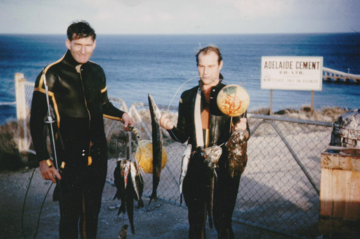 Max McIntyre, left, in diving gear at a beach in South Australia in the mid 1960s.
