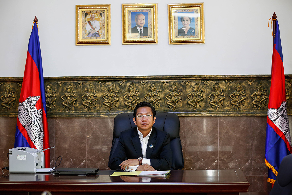 Huy Vannak sits at his desk in the Union of Journalist Federations of Cambodia’s new building in Phnom Penh. (Siv Channa/The Cambodia Daily)