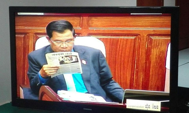 PM Hun Sen reading the Cambodia Daily