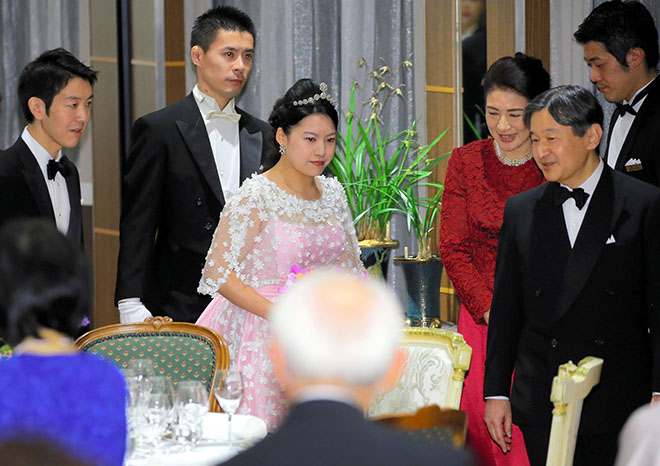 Ayako shines in silk dress from Cambodia at wedding party