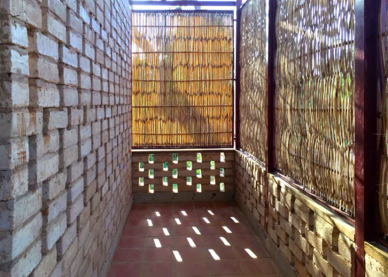 Agriculture center in Cambodia uses earth bricks, clay and bamboo for natural ventilation