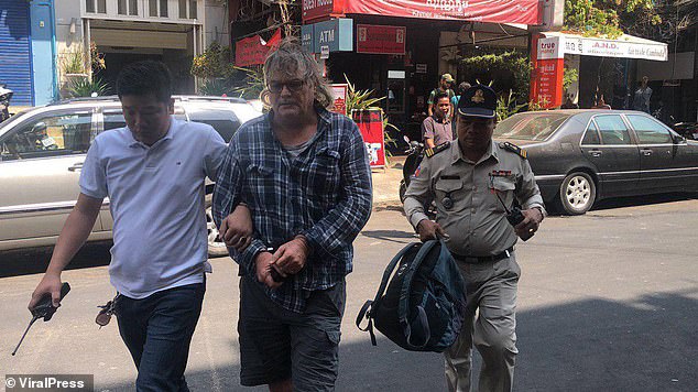 American man is arrested in a child sex brothel in Cambodia after cops watched him for two days before raiding the ‘massage parlor’ where he admitted giving one girl $100 a month