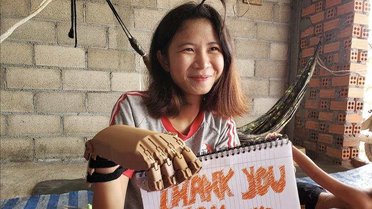 Brother Rice robotics students design and build functioning prosthetic hands for Cambodian teen