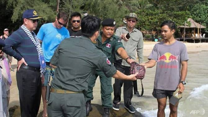 Cambodian soldiers, divers scour island for missing British tourist