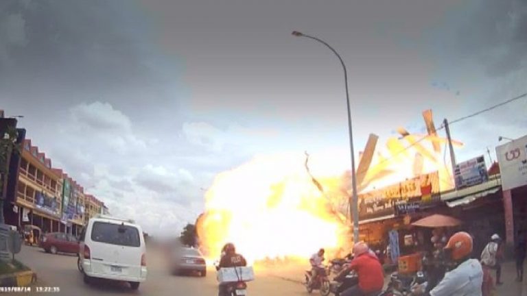 ‘It just went boom’: Horrifying moment tourist is caught in petrol station explosion