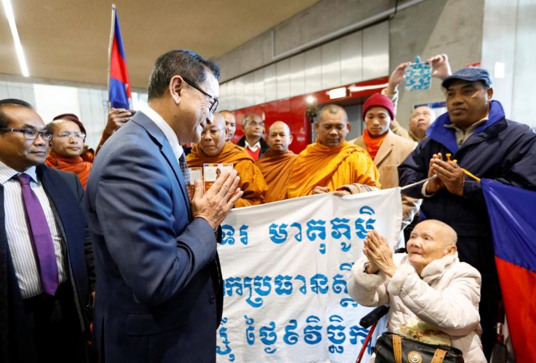 Cambodian opposition founder says he was blocked from boarding plane home from Paris