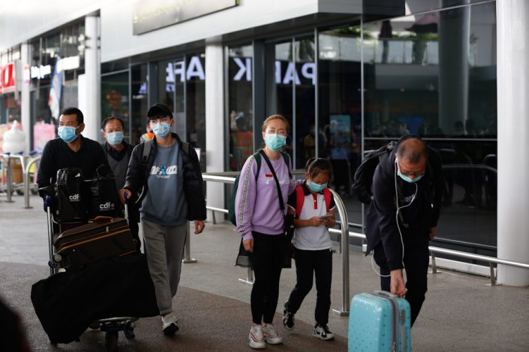 Authorities tracking down travelers who shared flight with coronavirus patient