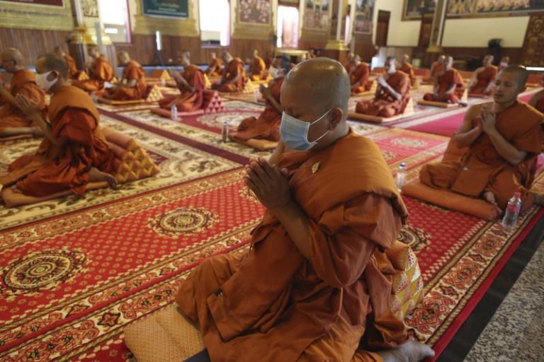 Buddhist monks in Cambodia and Thailand adapt rituals during pandemic