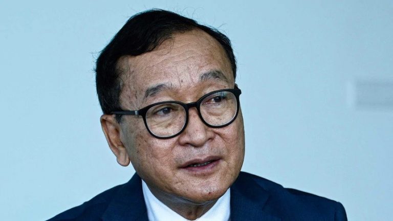 Cambodian opposition figure Sam Rainsy slapped with 25-year jail sentence as Australians face ‘incitement’ trial