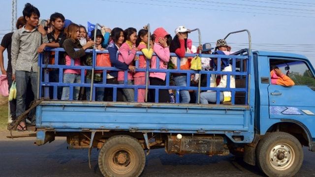 Truck transporting Cambodian garment workers overturns, leaving 60 injured: police